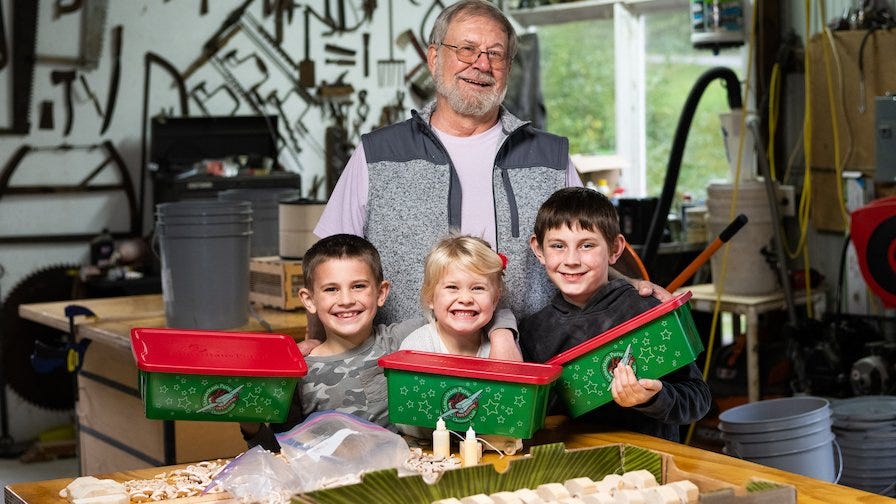 Wooden cars are packed into Operation Christmas Child shoeboxes